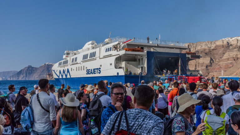Santorini, Greece - September 4th 2023: Tourists from all over the world arrive or depart from the port of Thira