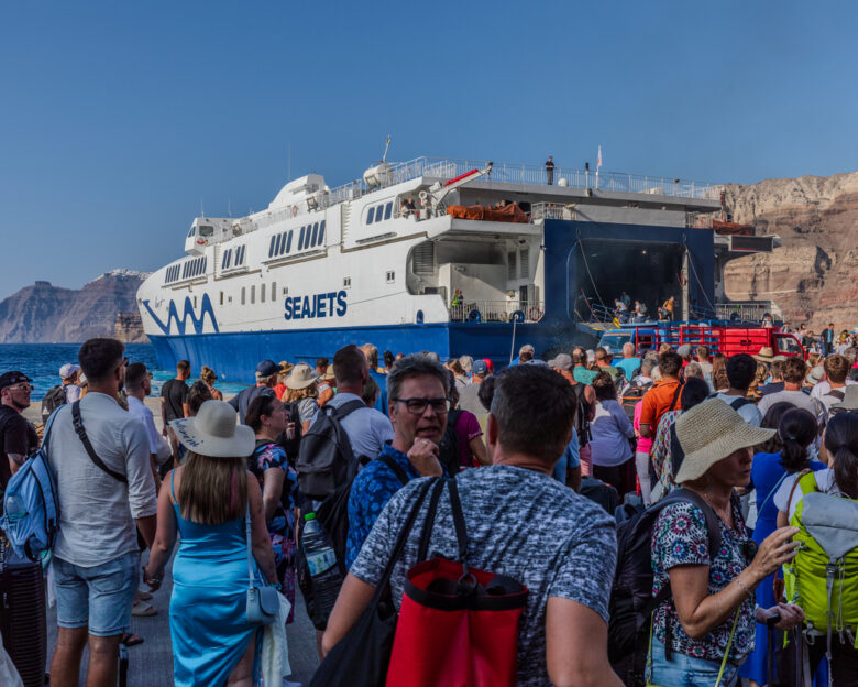 Santorini, Greece - September 4th 2023: Tourists from all over the world arrive or depart from the port of Thira