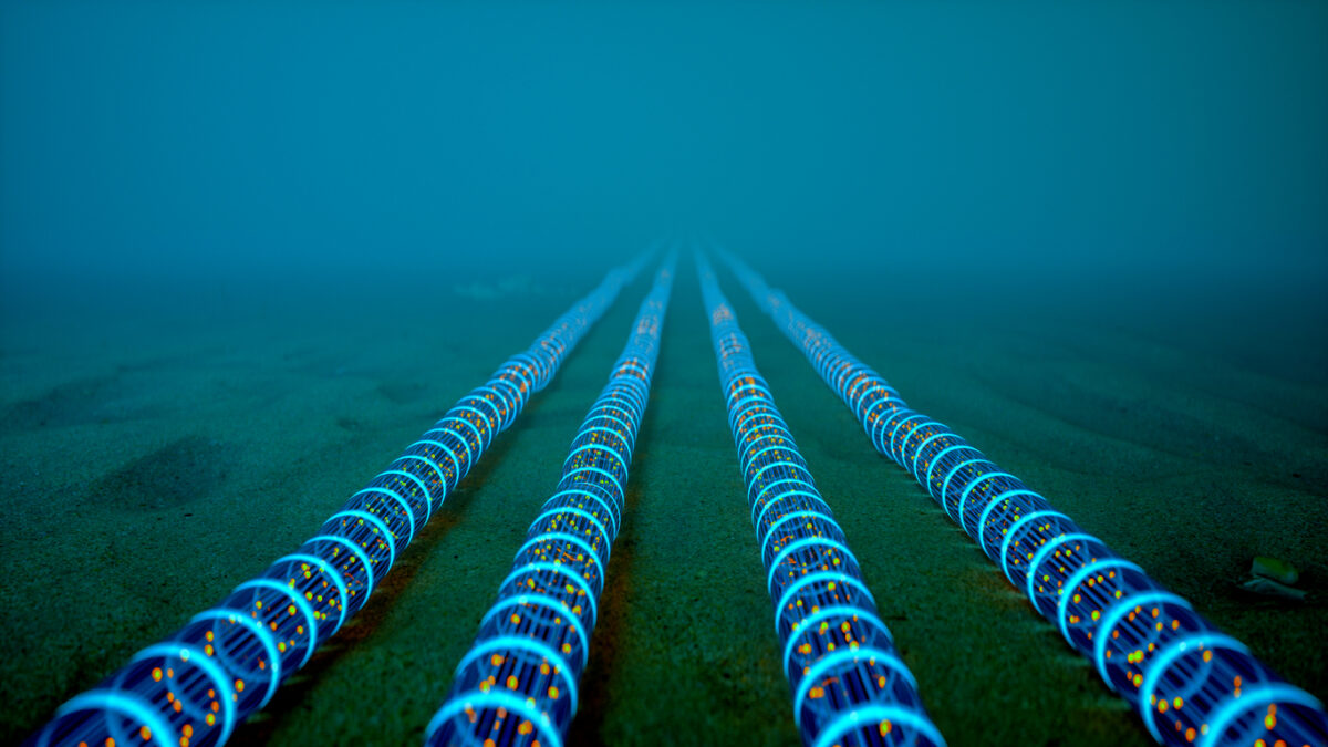 High-tech fiber optic cables glowing with blue light extend into the distance on the ocean floor, symbolizing global communication networks.