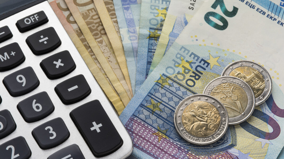 Close up of a calculator and euro money in a financial analyzing concept