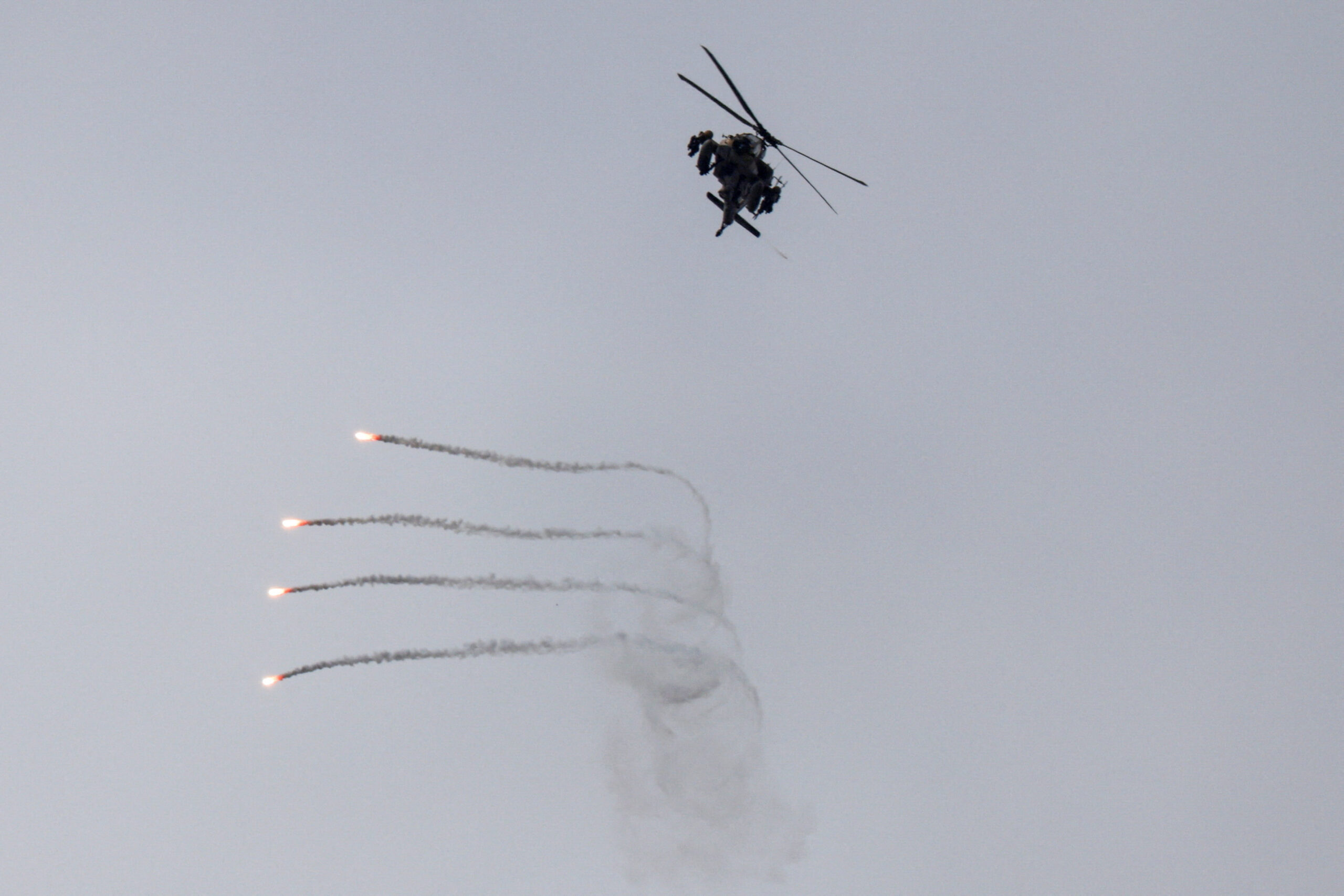 An Israeli helicopter releases flares, near the Israel-Lebanon border, as seen from the Israeli side of the border in northern Israel An Israeli helicopter releases flares, near the Israel-Lebanon border, as seen from the Israeli side of the border in northern Israel, April 14, 2026. REUTERS/Florion Goga REFILE - QUALITY REPEAT TPX IMAGES OF THE DAY
