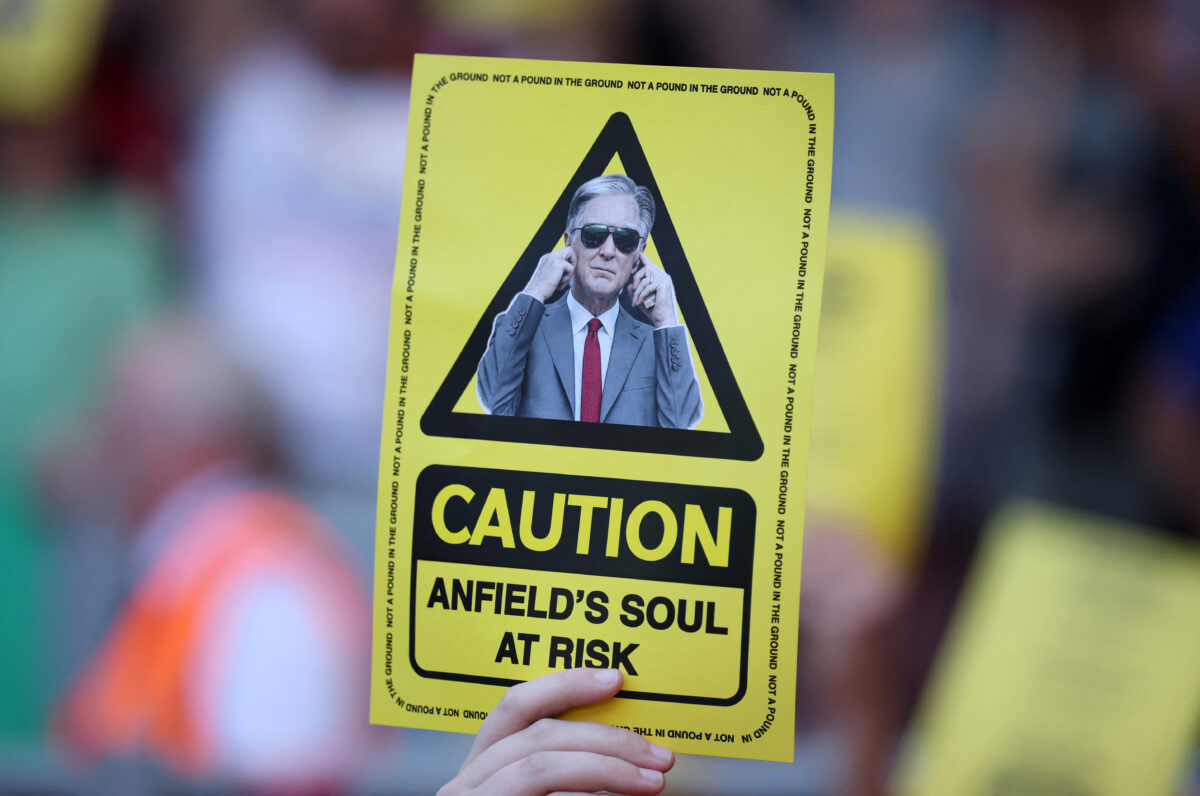 Soccer Football - Premier League - Liverpool v Crystal Palace - Anfield, Liverpool, Britain - April 25, 2026 Liverpool fans hold up yellow cards in protest against the ticket price increase REUTERS