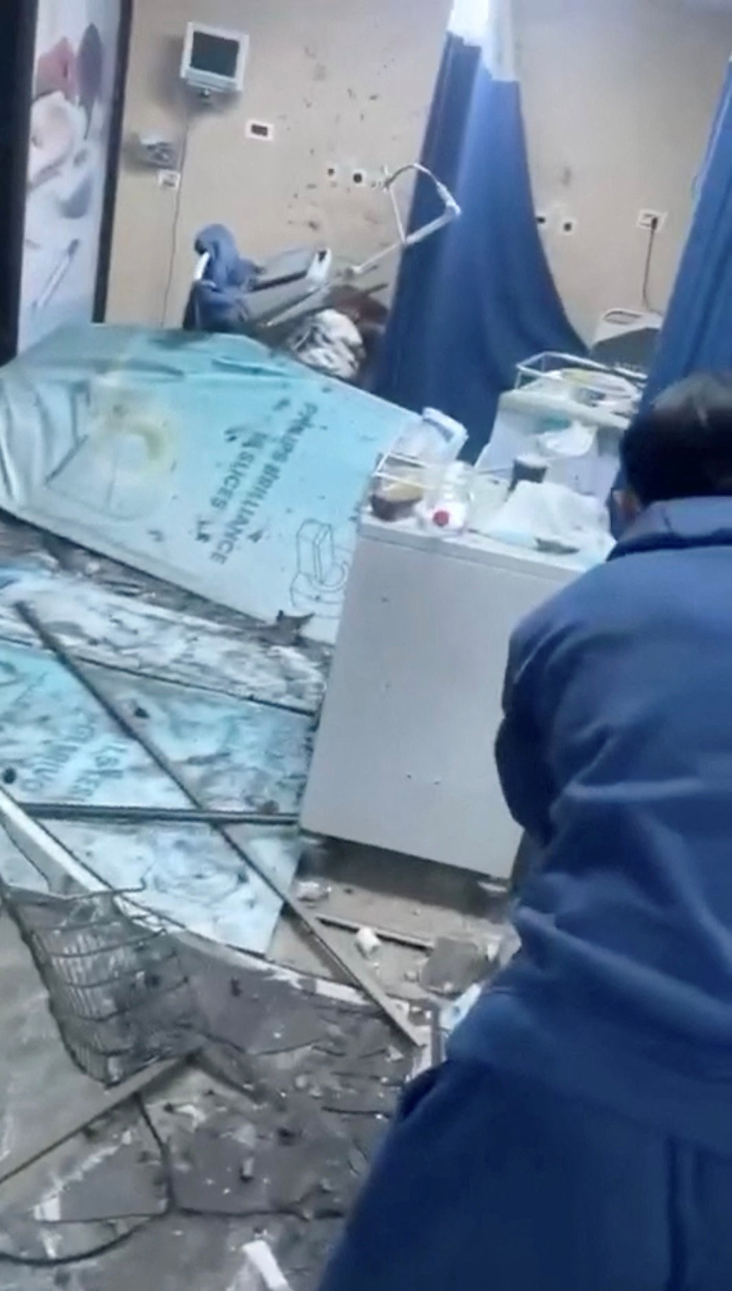 Debris lies scattered at the Tebnine Government Hospital following a strike, in Tebnine Debris lies scattered at the Tebnine Government Hospital following a strike, in Tebnine, Lebanon, in this still image obtained from a social media video released on April 14, 2026. Social Media/via REUTERS THIS IMAGE HAS BEEN SUPPLIED BY A THIRD PARTY. NO RESALES. NO ARCHIVES. NEWS USE ONLY. VERIFICATION - Reuters was able to confirm the location as Tebnine Government Hospital from the shape of the buildings, sign and interiors which matched file imagery of the area. - Coordinates: 33.196830734496345, 35.41551378304548. - The date of the footage could not be verified but local media reported about an attack on Tebnine on Tuesday and that the hospital had been damaged. - Multiple clips were also posted online showing the same location. - No old versions of the footage were found posted online before Tuesday.