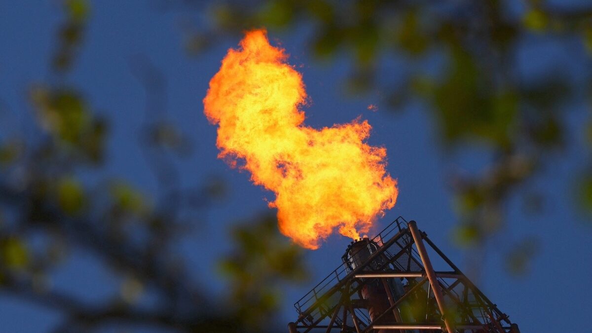Flames come out of a chimney at TotalEnergies refining and petrochemicals platform in the port of Antwerp, Belgium April 9, 2026. REUTERS/Yves Herman