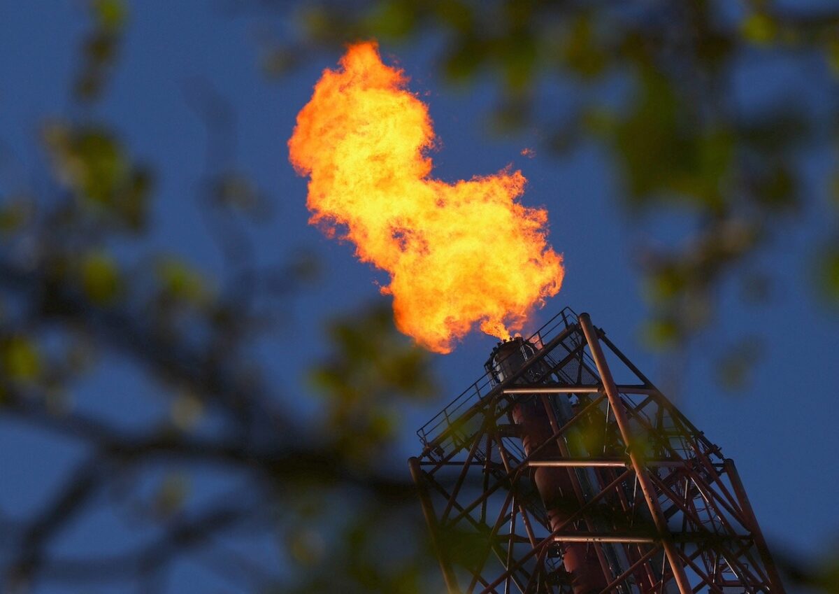Flames come out of a chimney at TotalEnergies refining and petrochemicals platform in the port of Antwerp, Belgium April 9, 2026. REUTERS/Yves Herman