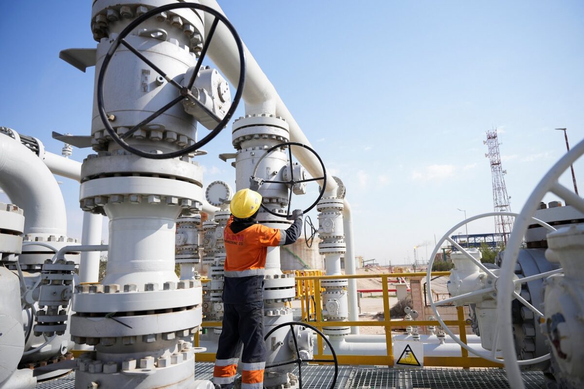 A worker operates valves at the Rumaila oil field, as the country cuts nearly 1.5 million barrels per day of output amid halted exports following the closure of the Strait of Hormuz, in Basra, Iraq, March 4, 2026.