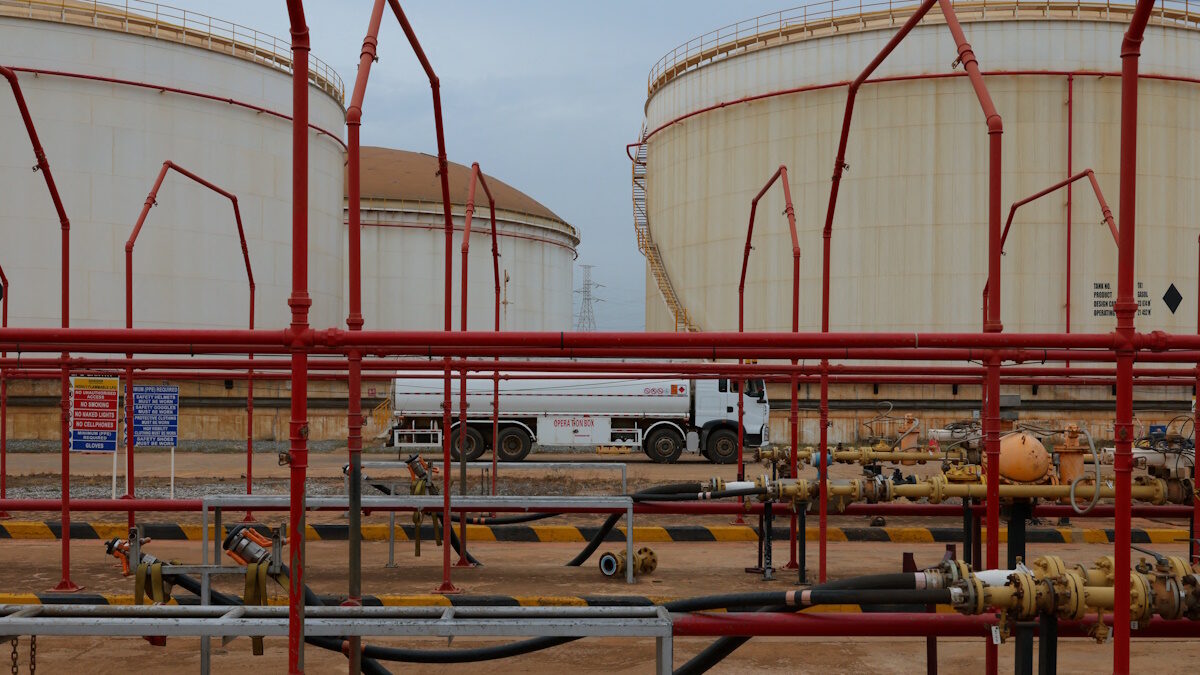 An oil tanker truck drives past fuel storage tanks at the Tema Fuel Company facility in Tema, Ghana, April 1, 2026. REUTERS/Francis Kokoroko