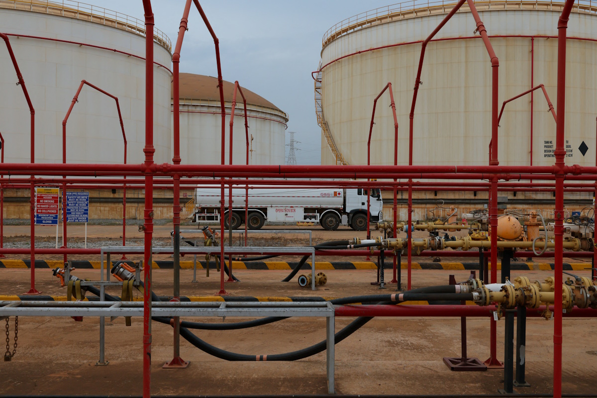 An oil tanker truck drives past fuel storage tanks at the Tema Fuel Company facility in Tema, Ghana, April 1, 2026. REUTERS/Francis Kokoroko