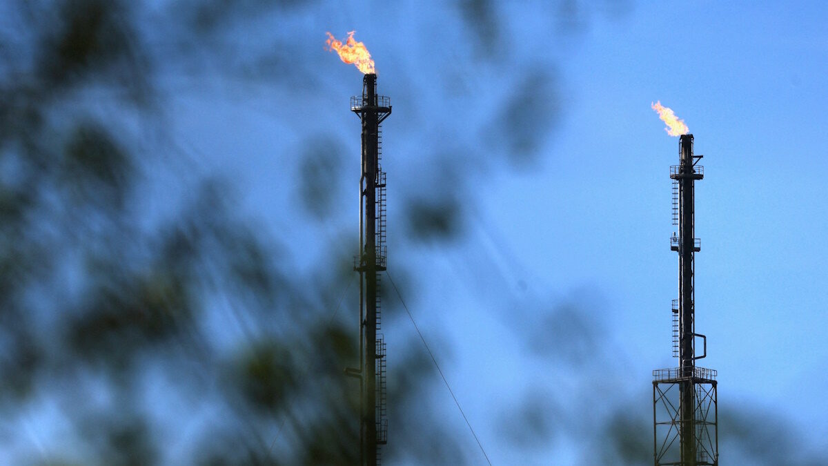 Flames come out of chimneys at a TotalEnergies hydrocarbones depot in Feluy, Belgium April 8, 2026. REUTERS/Yves Herman