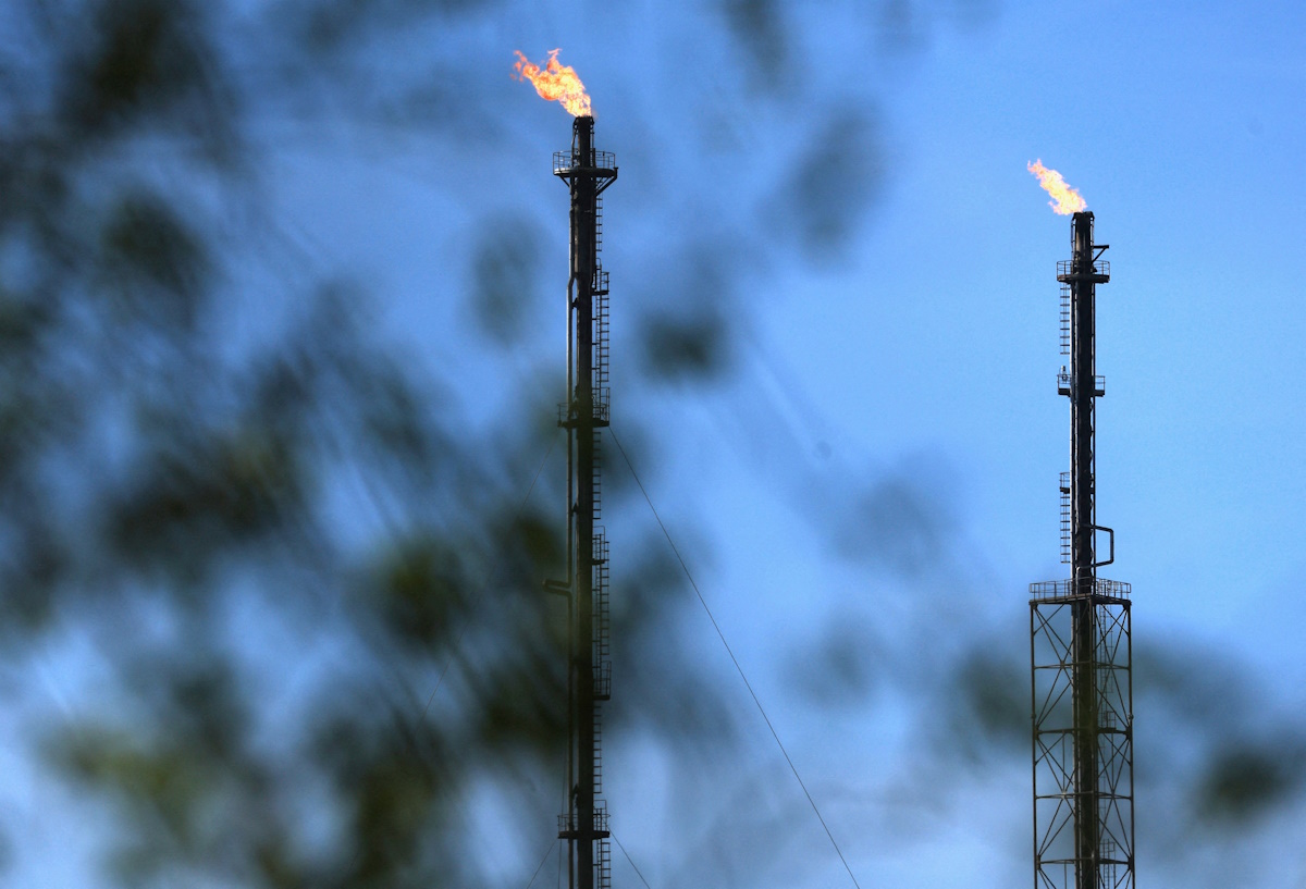 Flames come out of chimneys at a TotalEnergies hydrocarbones depot in Feluy, Belgium April 8, 2026. REUTERS/Yves Herman