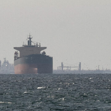 FILE PHOTO: Cargo ships in the Gulf, near the Strait of Hormuz, as seen from northern Ras al-Khaimah, near the border with Oman’s Musandam governance, amid the U.S.-Israeli conflict with Iran, in United Arab Emirates, March 11, 2026. REUTERS/Stringer/File Photo/File Photo