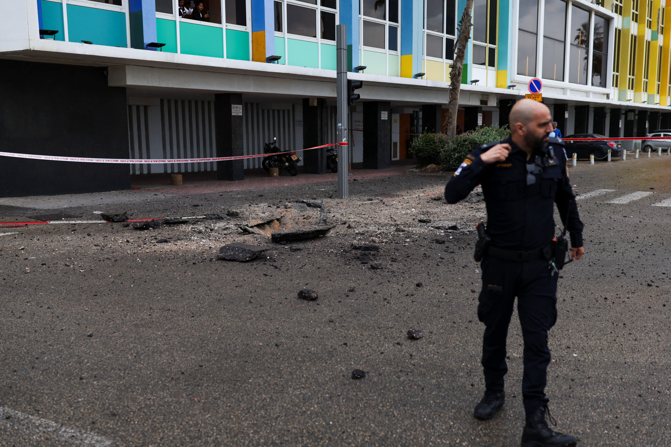 Damaged site after Iran launched missiles towards Israel, amid the U.S.-Israel conflict with Iran, in Tel Aviv An Israeli police officer stands near the site of damage, after Iran launched missiles towards Israel, amid the U.S.-Israel conflict with Iran, in Tel Aviv, Israel April 1, 2026. REUTERS/Ronen Zvulun