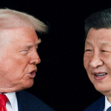 FILE PHOTO: U.S. President Donald Trump and Chinese President Xi Jinping talk as they leave after a bilateral meeting at Gimhae International Airport, on the sidelines of the Asia-Pacific Economic Cooperation (APEC) summit, in Busan, South Korea, October 30, 2025. REUTERS/Evelyn Hockstein/File Photo