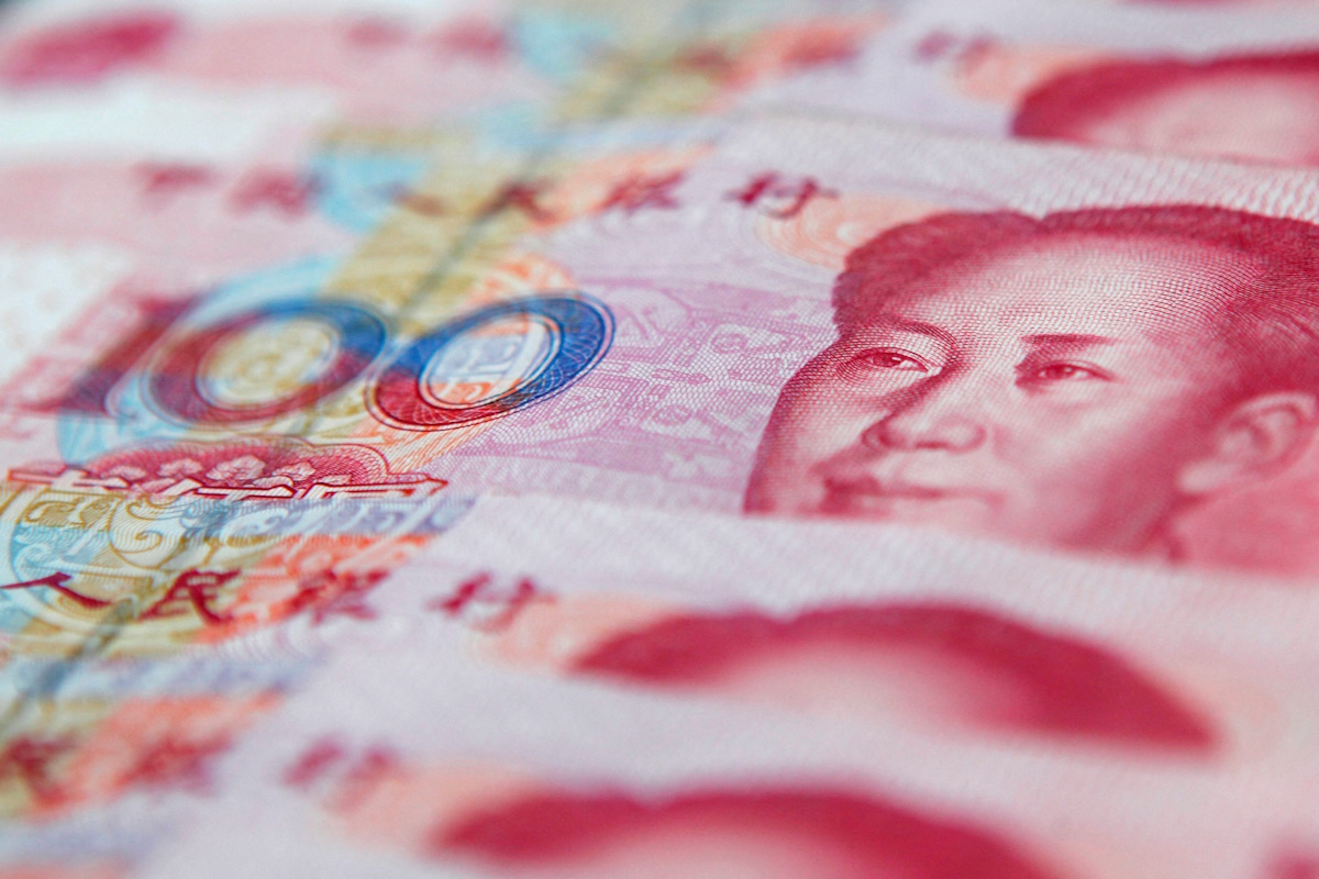 FILE PHOTO: FILE PHOTO: Chinese 100 yuan banknotes are seen in this picture illustration created in Shanghai on January 17 , 2011. REUTERS/Carlos Barria/File Photo/File Photo