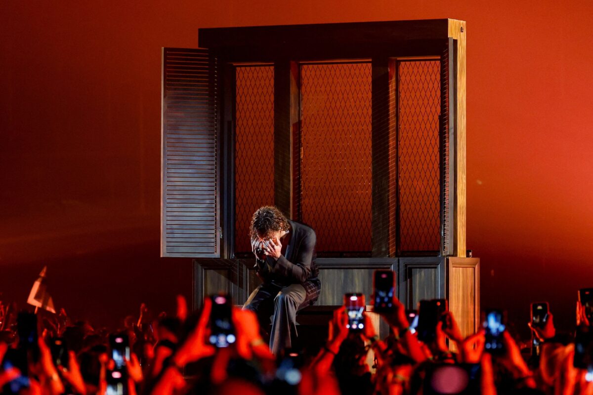 Pete Parkkonen sings while he and Linda Lampenius perform “Liekinheitin,” representing Finland during the first semi-final of the 2026 Eurovision Song Contest, in Vienna, Austria, May 12, 2026. REUTERS