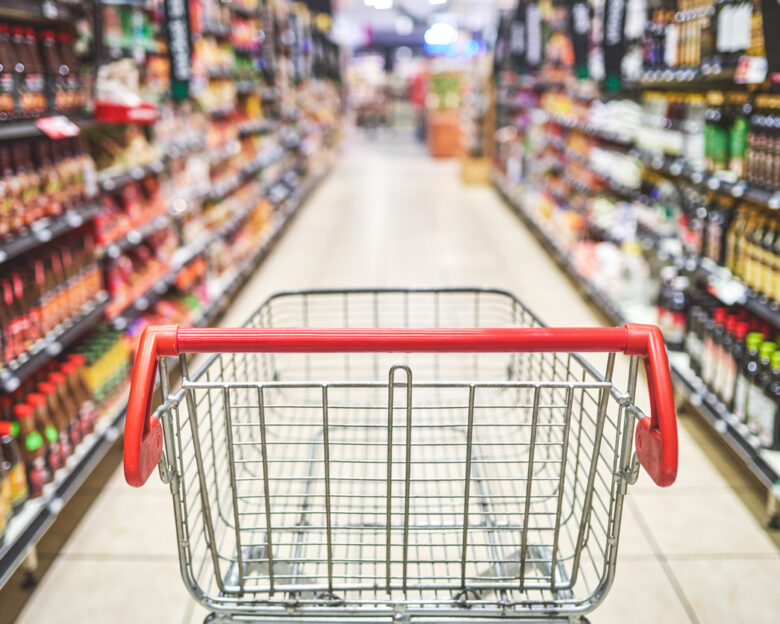 Shot of an empty shopping cart in a grocery store