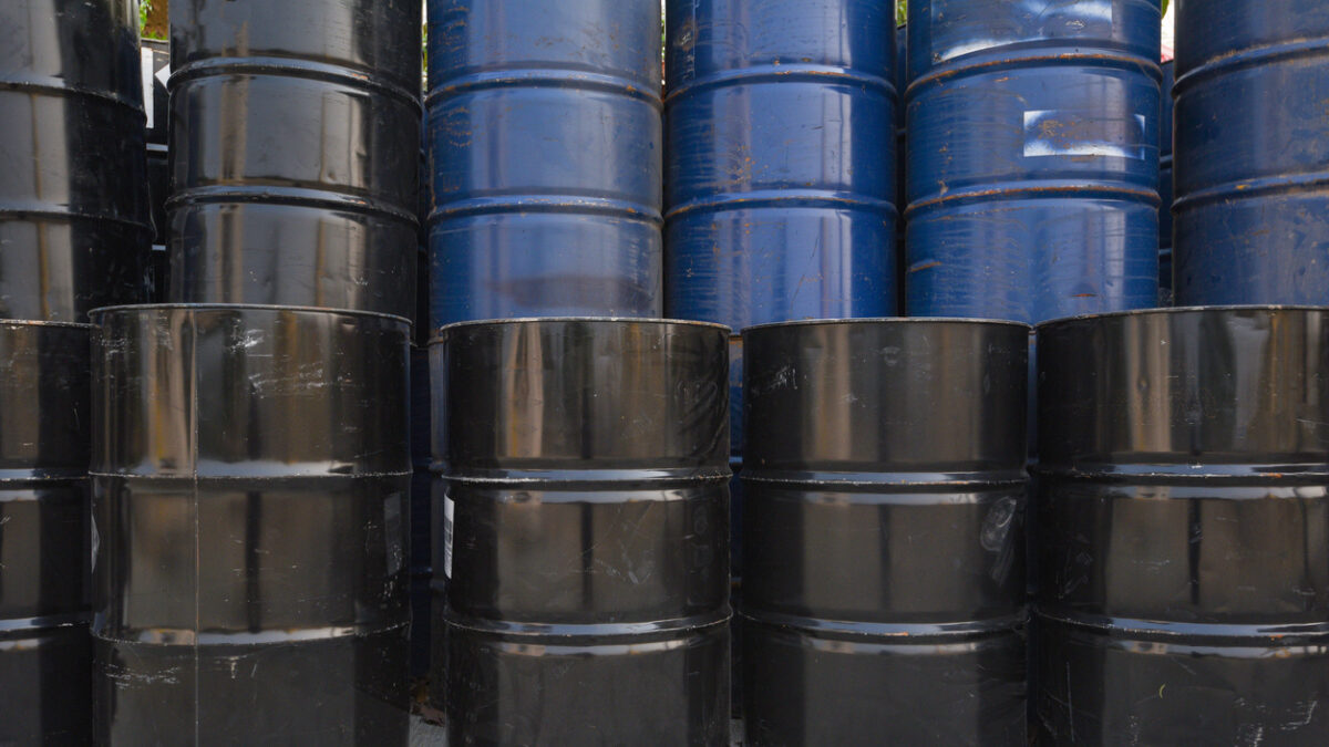 old oil barrels or chemical drums stacked up, industry oil barrel