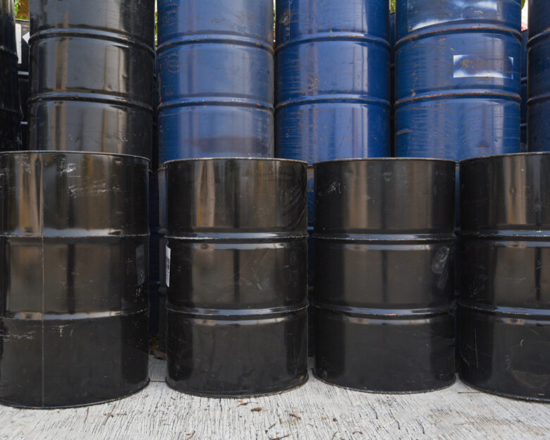 old oil barrels or chemical drums stacked up, industry oil barrel