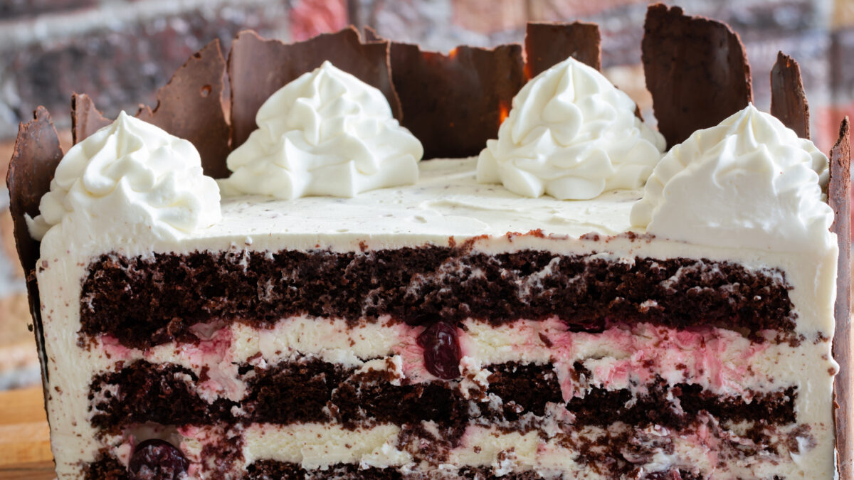 Black forest cake, Schwarzwald pie, dark chocolate and cherry dessert . Black forest cake decorated with whipped cream