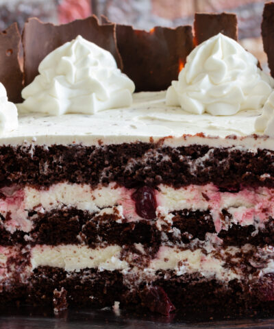 Black forest cake, Schwarzwald pie, dark chocolate and cherry dessert . Black forest cake decorated with whipped cream