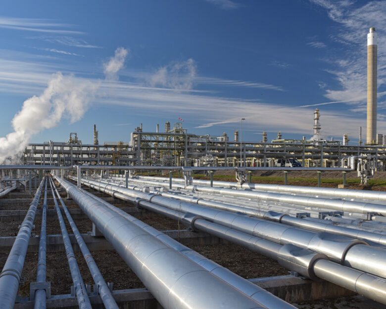 pipelines and buildings of a refinery - industrial plant for fuel production