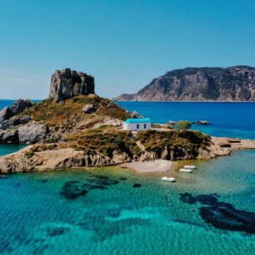 A natural view of the Kos Island and Kefalos Beach in Greece under a clear sunny sky