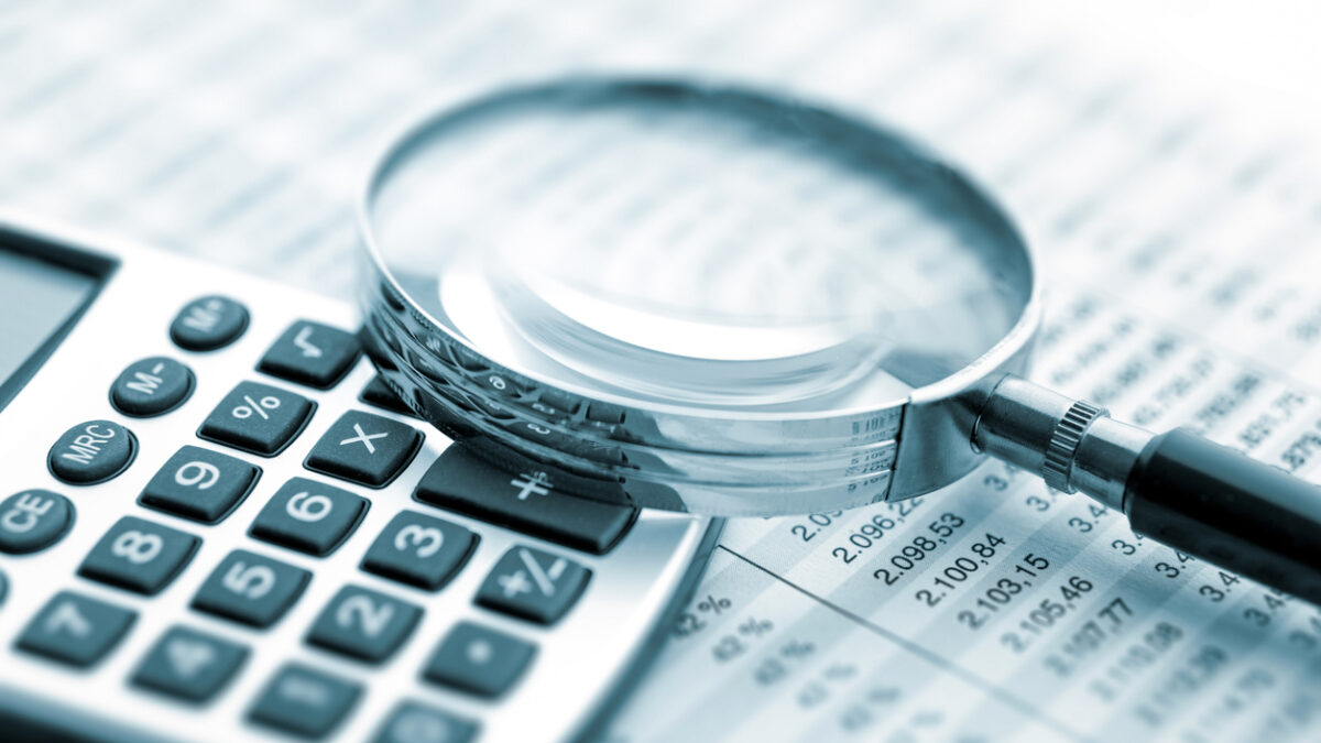 Magnifying glass on financial chart