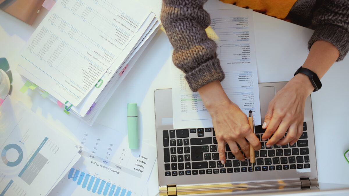 accountant woman with documents and laptop working