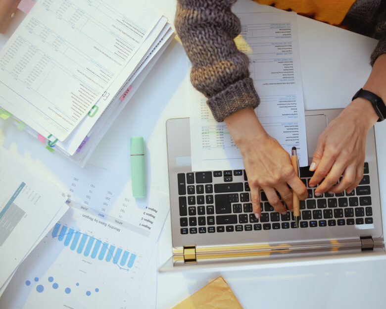 accountant woman with documents and laptop working
