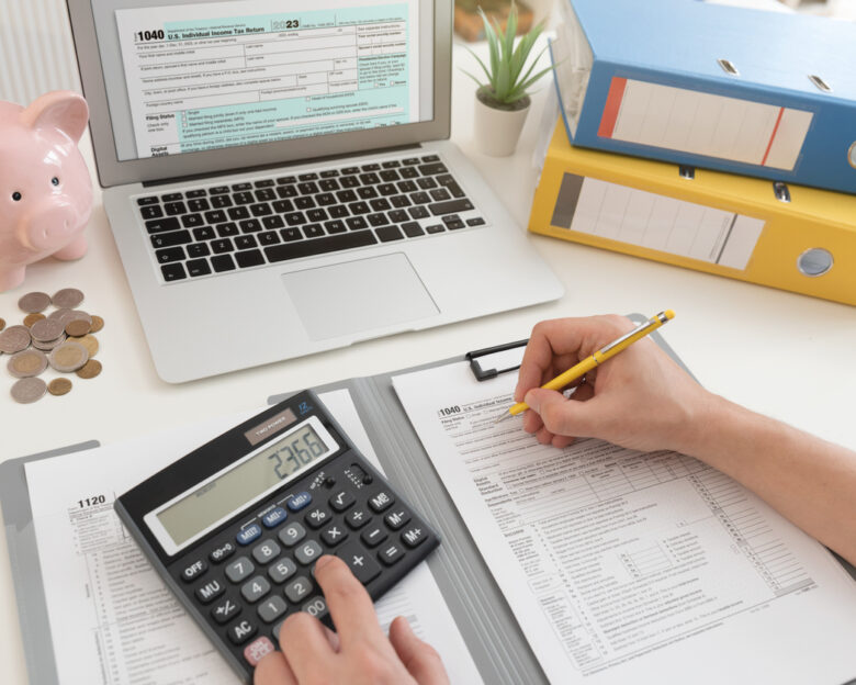 Income tax concept with laptop and US tax forms