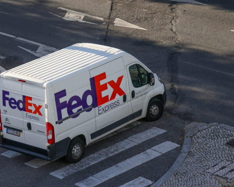 Lisbon, Portugal October 25, 2024, White fedex express delivery van parked on a city street, ready for shipping and logistics operations