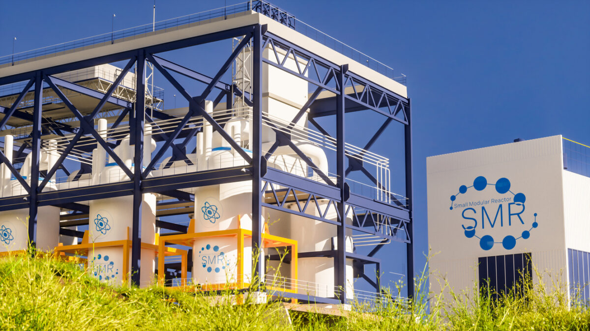 concept of a SMR small modular nuclear reactor power plant on a sunny day. SMR is a future energy concept. 3d rendering.