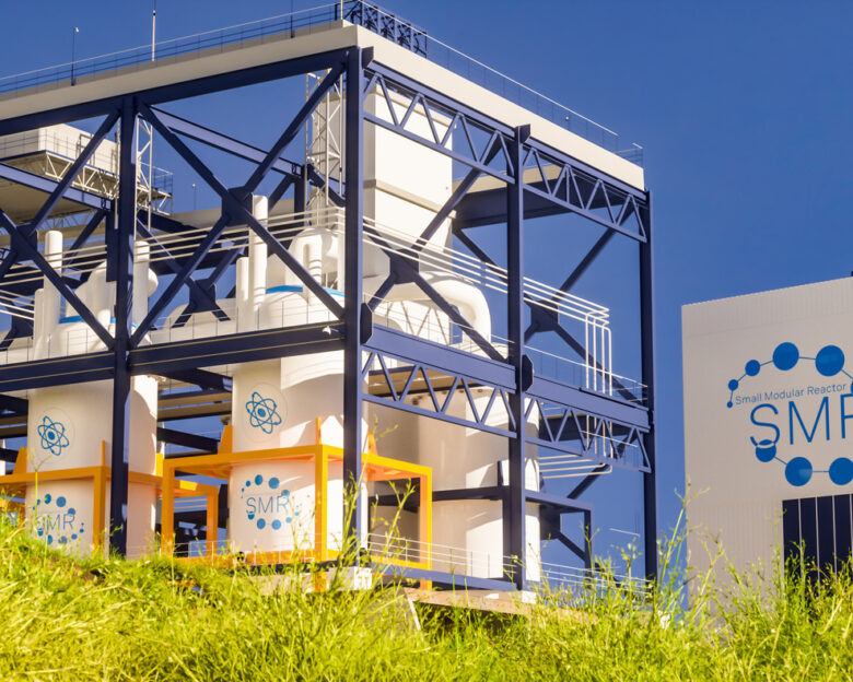 concept of a SMR small modular nuclear reactor power plant on a sunny day. SMR is a future energy concept. 3d rendering.