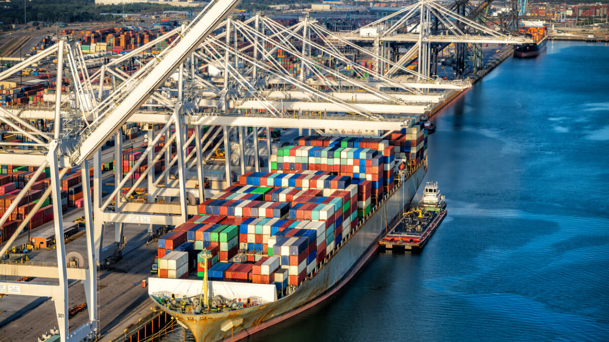 A fully loaded cargo ship docked at the Port of Houston on Galveston Bay, Texas shot via helicopters from an altitude of about 500 feet.