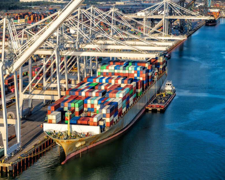 A fully loaded cargo ship docked at the Port of Houston on Galveston Bay, Texas shot via helicopters from an altitude of about 500 feet.