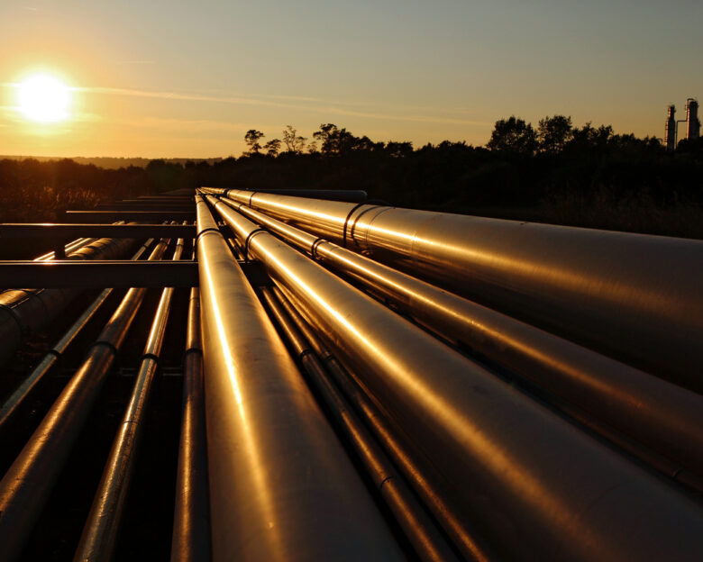 golden colour of steel pipeline system during sunset