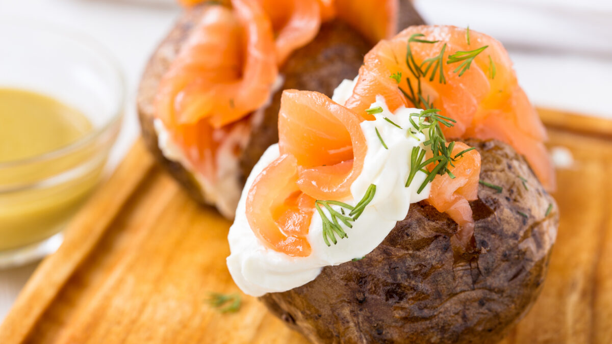 Crispy jacket potatoes with light soft cheese and smoked salmon