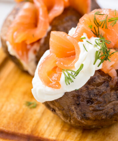 Crispy jacket potatoes with light soft cheese and smoked salmon