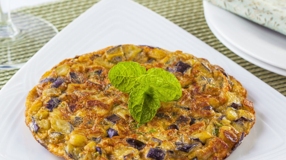 Eggplant omelet served on a white plate. Perfect for brunch.
