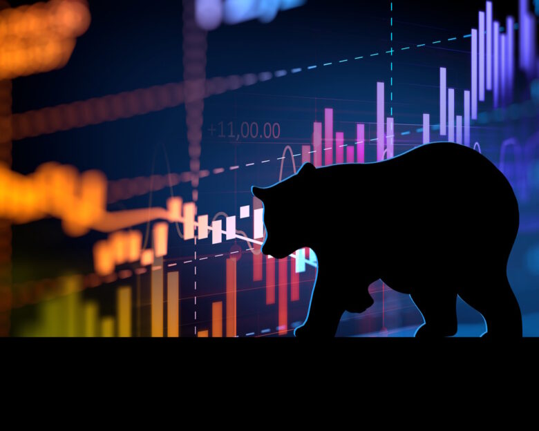 silhouette form of bear on financial stock market graph represent stock market crash or down trend investment