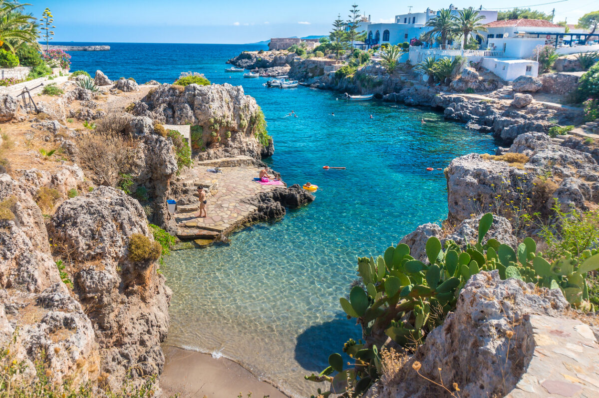 People swimming in a beach in Avlemonas village in Kythera island in Greece