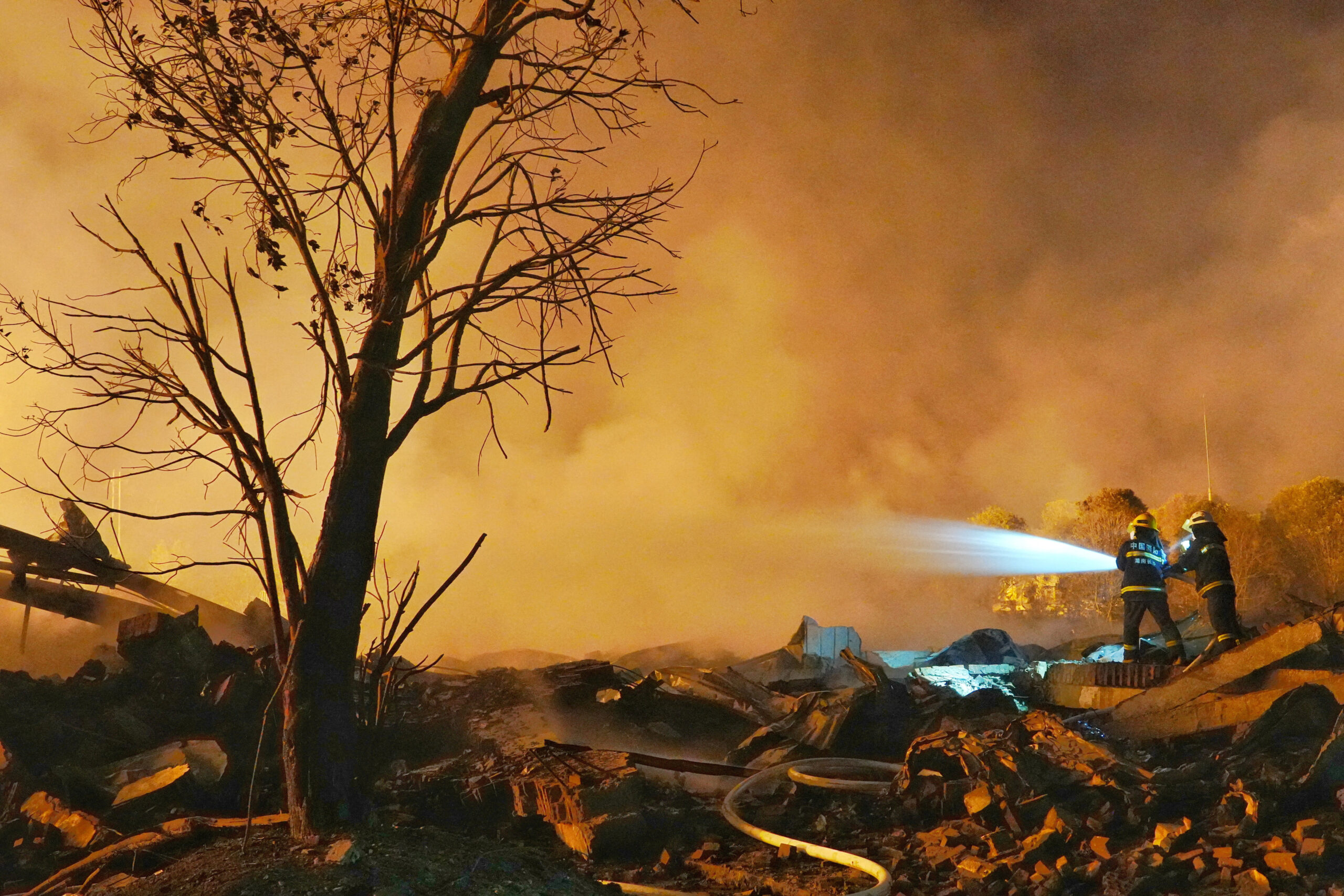 Firefighters work to extinguish a fire following a blast at a fireworks manufacturing factory in Liuyang, Hunan province, China, May 5, 2026. cnsphoto via REUTERS ATTENTION EDITORS - THIS IMAGE WAS PROVIDED BY A THIRD PARTY. CHINA OUT. TPX IMAGES OF THE DAY