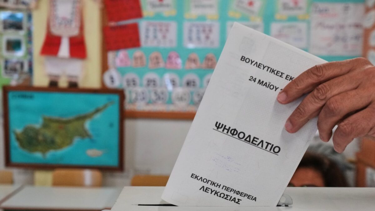 A voter casts a ballot at a polling station during the parliamentary elections in capital Nicosia, Cyprus