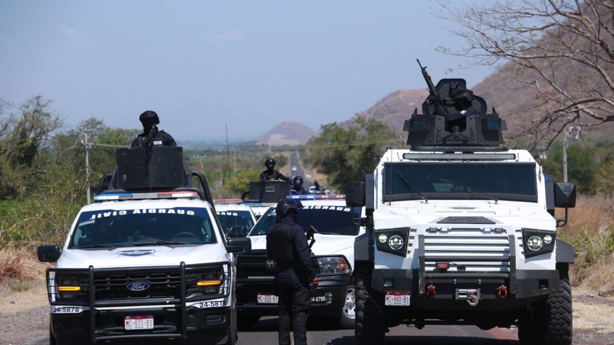 National Guards patrol a highway near Aguililla, Mexico, Tuesday, Feb. 24, 2026, after the Mexican army killed Jalisco New Generation Cartel leader Nemesio Oseguera Cervantes, known as "El Mencho."