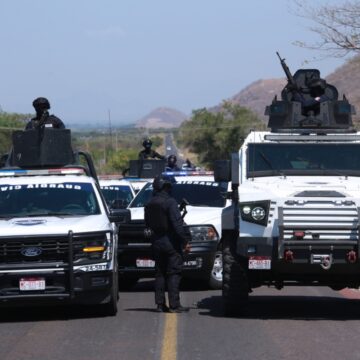 National Guards patrol a highway near Aguililla, Mexico, Tuesday, Feb. 24, 2026, after the Mexican army killed Jalisco New Generation Cartel leader Nemesio Oseguera Cervantes, known as "El Mencho."