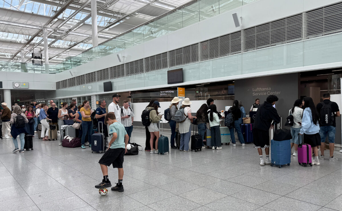 People stand in line at Munich Airport as flights resumed after possible drone sighting in Munich, Germany, May 30, 2026. Flights were halted for about an hour at Munich Airport in southern Germany on Saturday morning after two pilots reported seeing a drone, airport authorities and police said, confirming initial reports by German media. During the shutdown more than 20 flights that had been due to land at Munich were diverted to other airports, an airport spokesperson said. REUTERS/Louisa Off