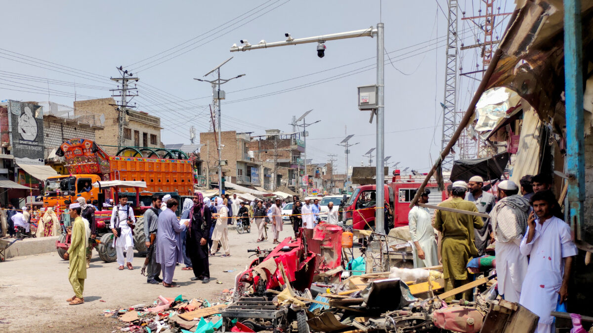 People and police officers in plain clothes gather after a blast at a market in Lakki Marwat, Khyber Pakhtunkhwa province, Pakistan, May 12, 2026. Picture taken with a mobile phone. REUTERS