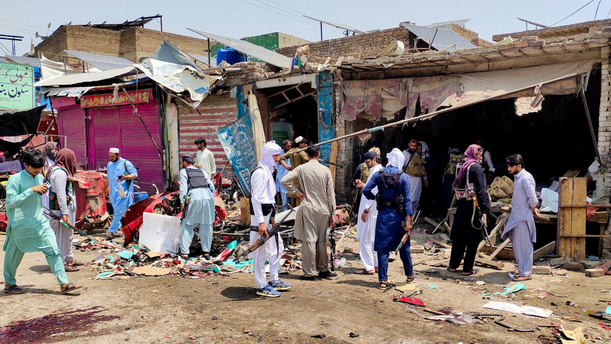 Police officers in plain clothes gather after a blast at a market in Lakki Marwat, Khyber Pakhtunkhwa province, Pakistan, May 12, 2026. Picture taken with a mobile phone. REUTERS/Syed Basit