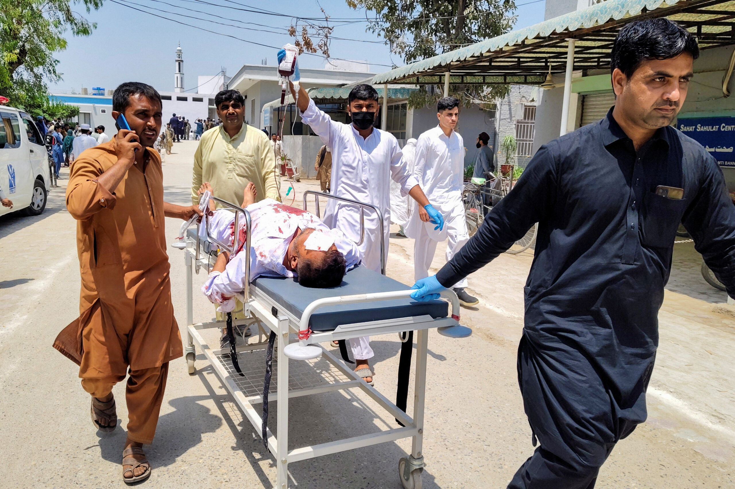 People move an injured man, who was wounded in a blast at a market in Lakki Marwat, at a hospital in Bannu, Khyber Pakhtunkhwa province, Pakistan, May 12, 2026. Picture taken with a mobile phone. REUTERS/Ehsan Khattak
