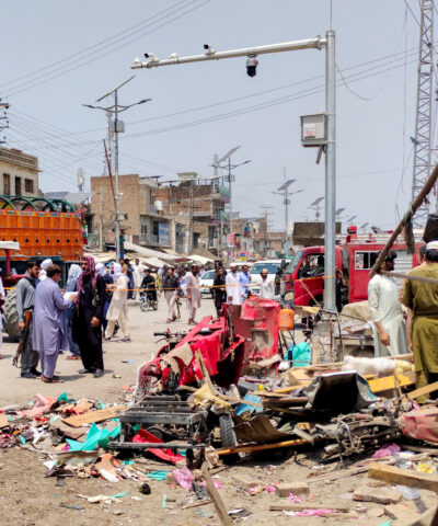 People and police officers in plain clothes gather after a blast at a market in Lakki Marwat, Khyber Pakhtunkhwa province, Pakistan, May 12, 2026. Picture taken with a mobile phone. REUTERS